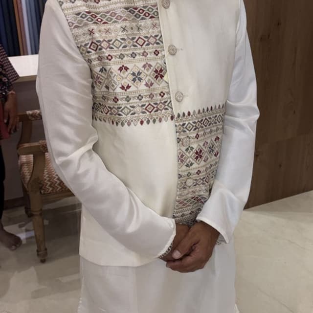 Off-white base with maroon, olive, and metallic accents Nehru Jacket over Kurta
