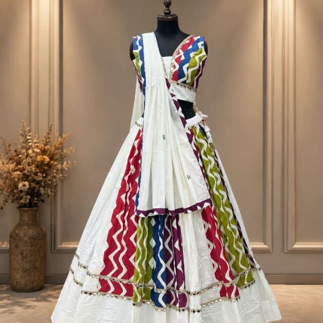 White base with multicolor chevron panels including red, green, blue, and purple Lehenga Choli