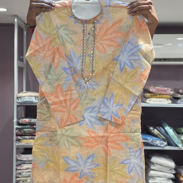 Pastel peach base with light blue, mint green, and pale yellow leaf patterns Kurta