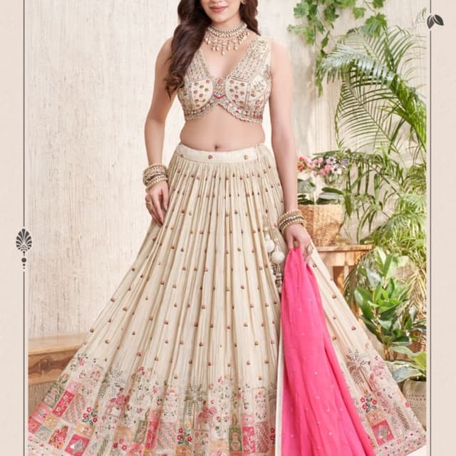 Cream, beige, off-white, with multi-colored floral embroidery and a hot pink dupatta Lehenga Choli