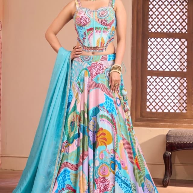 Multi-colored featuring bright blue, pink, yellow, orange, and green on a soft blue background Lehenga Choli