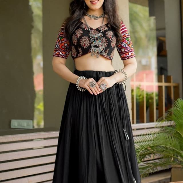 Black base with multi-color embroidery (red, white, orange, green) and gold accents Lehenga Choli
