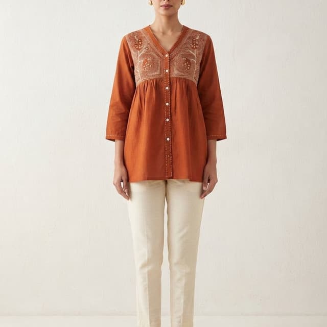 Burnt orange/rust top with off-white/beige trousers Kurta and Pant set