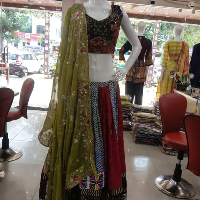 Olive green, deep red, black, white, and multi-colored accents Lehenga Choli