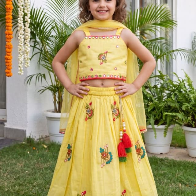 Bright yellow base with red and green accents Lehenga Choli