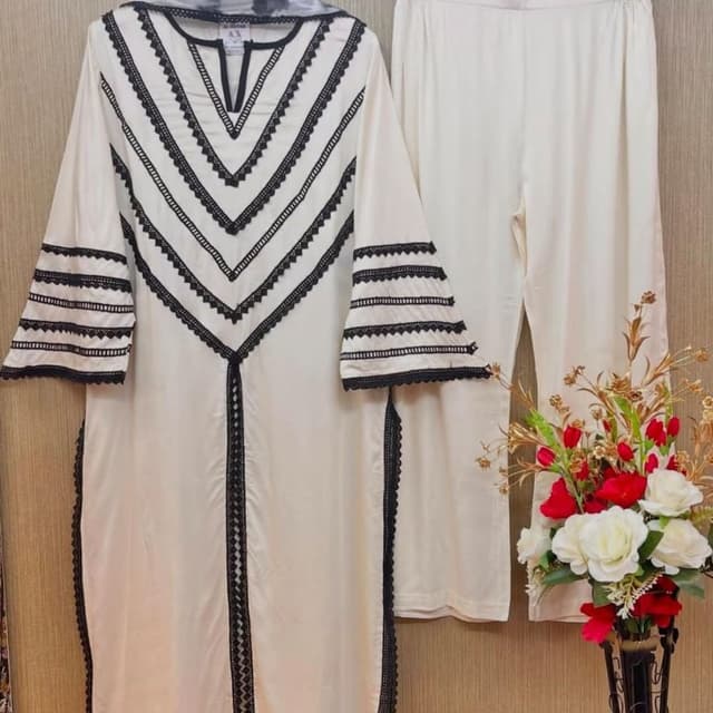 Off-white base with black lace accents Kurta set with pants