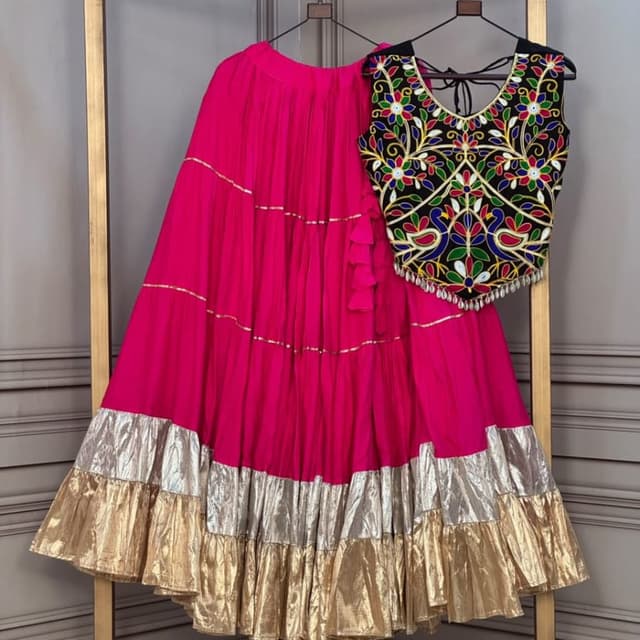 Hot pink skirt, black blouse with multi-colored thread work Lehenga Choli