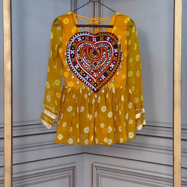 Mustard yellow base with multi-color embroidery including red, white, blue, and orange accents Peplum Top