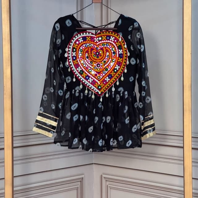 Black base with multi-colored embroidery (red, yellow, orange, green) and gold accents Peplum Top