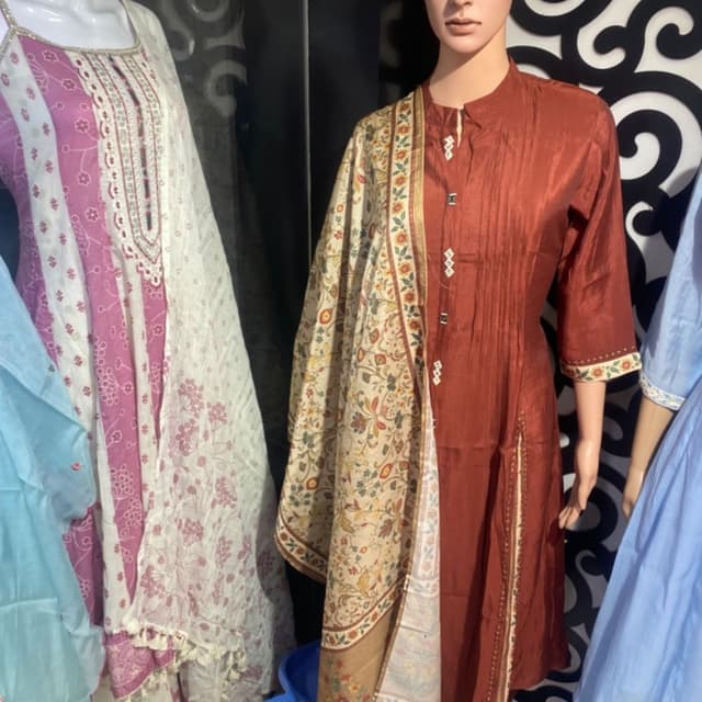 Rust brown, cream, muted floral tones Salwar Kameez