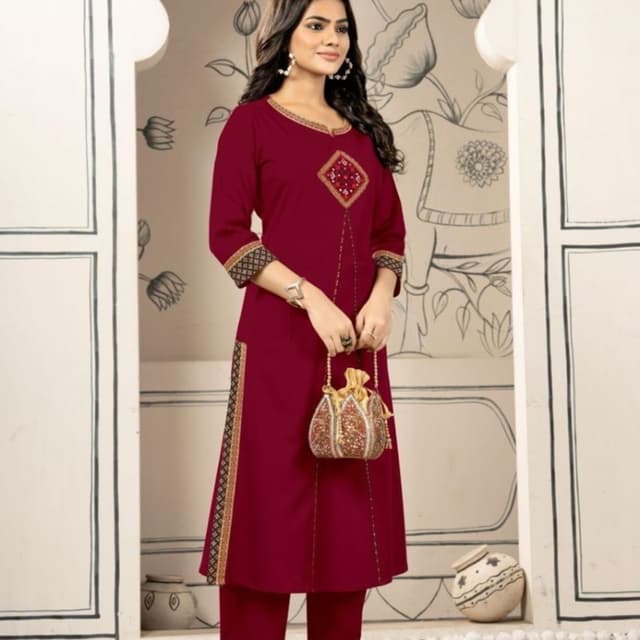 Deep maroon or burgundy with gold and black accents Kurta set with pants