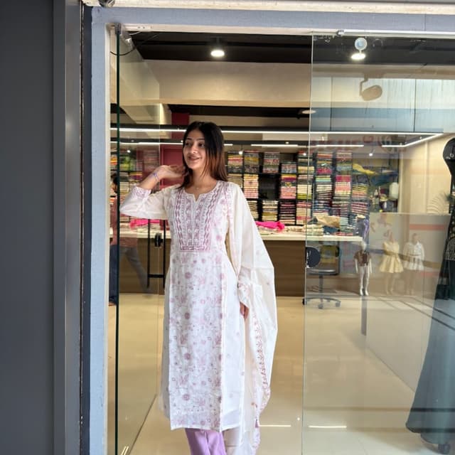 Off-white or cream base with light pink or mauve embroidery Kurta Set