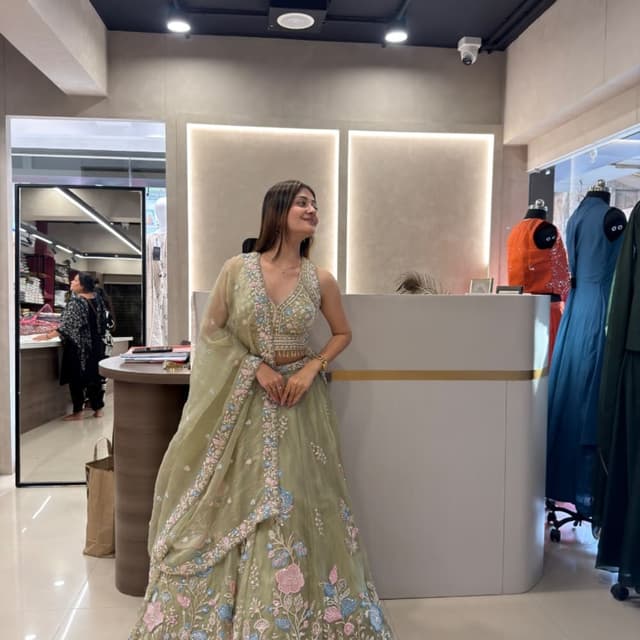 Sage green base with pastel pink, sky blue, and white floral embroidery Lehenga Choli