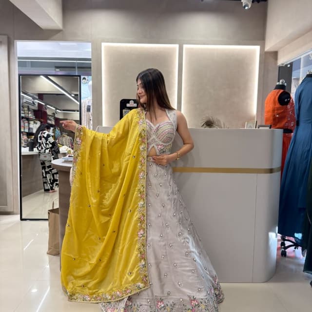 Light grey, vibrant yellow, multi-colored floral accents Lehenga Choli