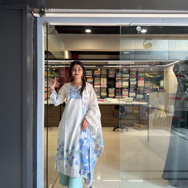 Off-white base with varied shades of blue and teal Kurta Set with Dupatta