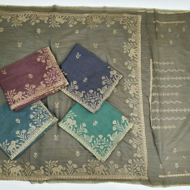 Olive green base, with navy blue, maroon, and emerald green accents featuring gold threadwork. Saree