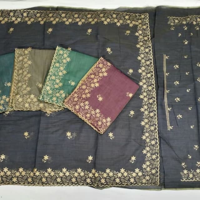 Charcoal grey, forest green, deep plum, and gold Saree