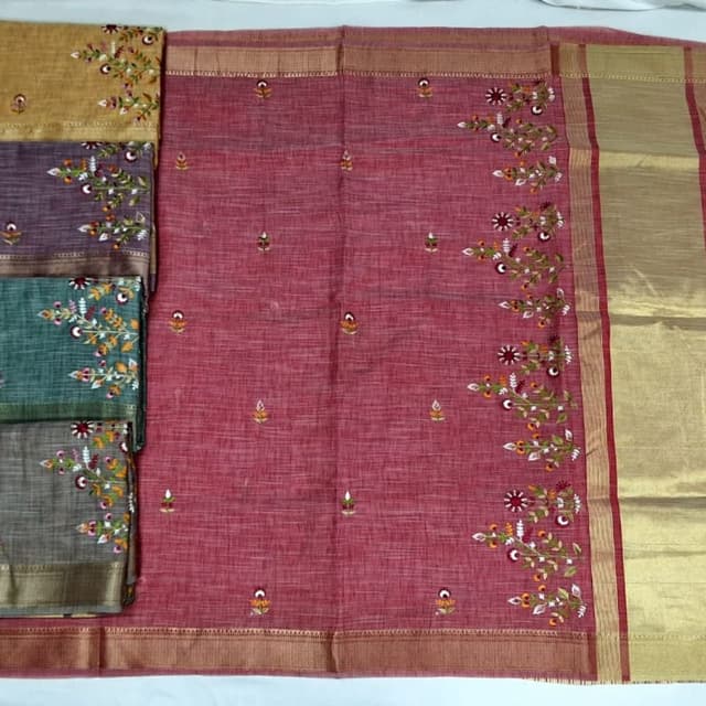Mauve/Dusty Pink base with accents of red, orange, green, and cream in embroidery; metallic copper/gold border Saree