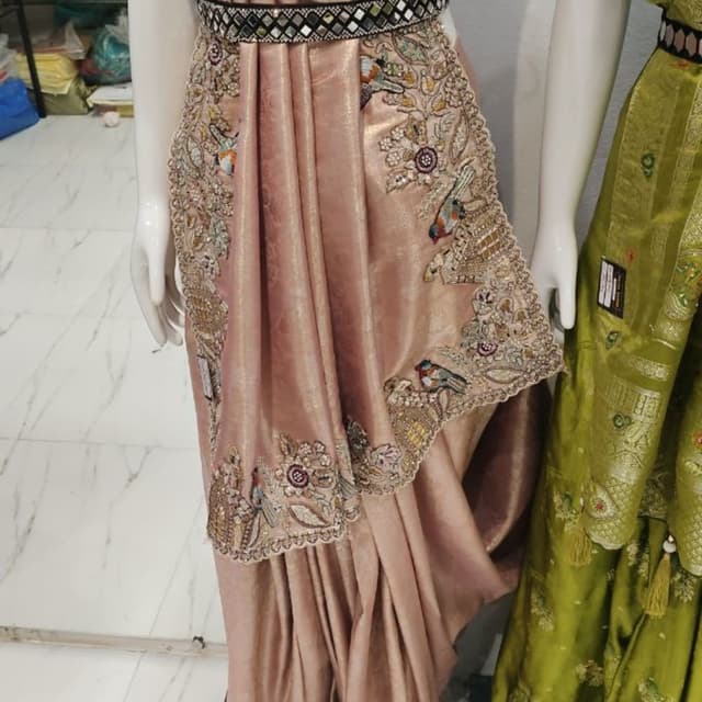 Dusty rose or muted peach with multi-colored embroidery Saree