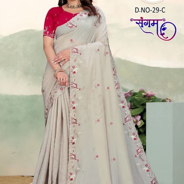 Light grey or beige base with deep pink/fuchsia accents Saree