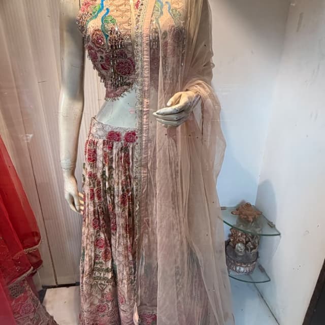 Peach, dusty rose, accents of teal, green, and deep red Lehenga Choli