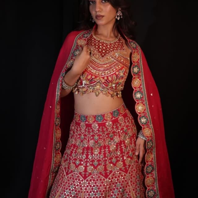 Red with gold, teal, and beige accents Lehenga Choli