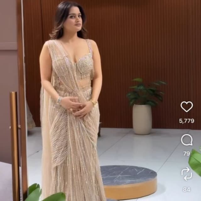 Champagne gold, beige, and metallic silver Saree-style lehenga or pre-draped saree gown