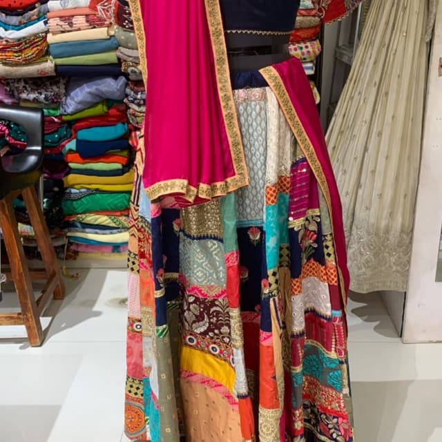 Multicolor with dominant navy blue, hot pink, red, mustard yellow, and teal accents Lehenga Choli