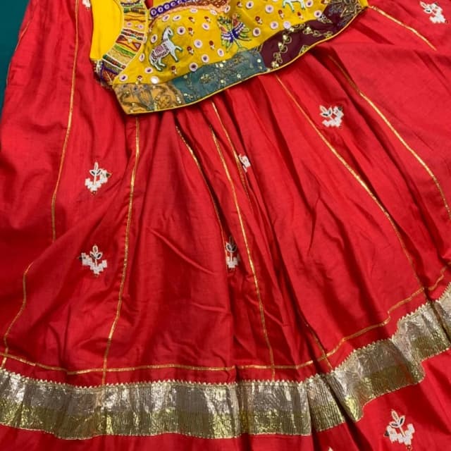 Vibrant Red, Mustard Yellow, Multi-colored accents Lehenga Choli
