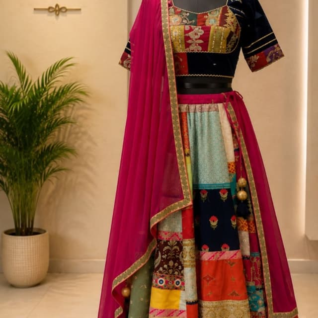 Multicolor with dominant navy blue, deep pink, olive green, mustard, and peach Lehenga Choli