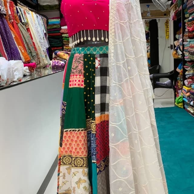 Hot pink, dark green, off-white, black, and multi-colored patchworks Lehenga Choli