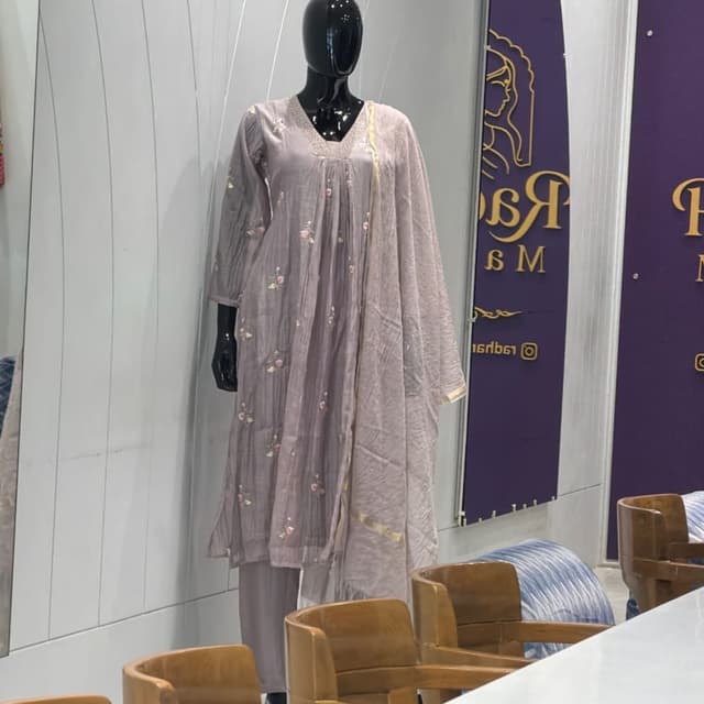 Muted mauve or dusty lavender base with pink, green, and gold accents Salwar Kameez set
