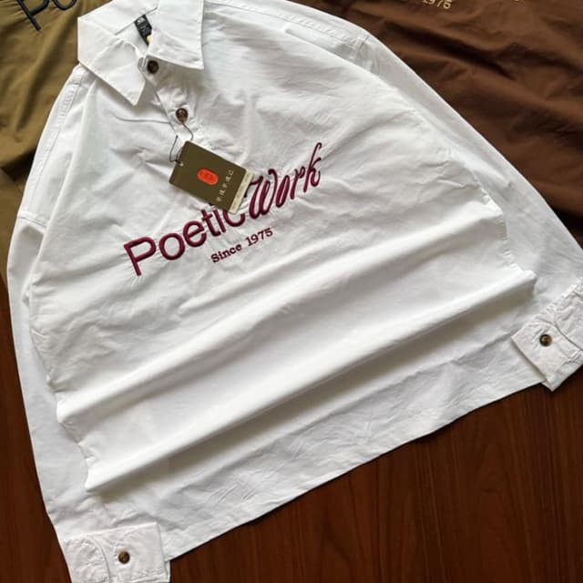 White base with deep burgundy red embroidery and brown buttons Shirt