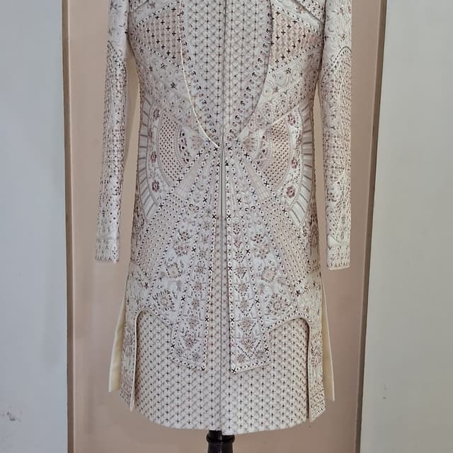 Off-white, cream, metallic gold, and soft copper/bronze Sherwani
