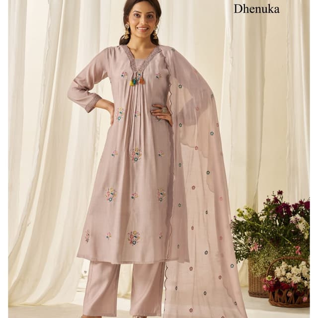 Muted mauve or dusty pink base with multi-colored floral embroidery and tassel accents Kurta Set with Dupatta