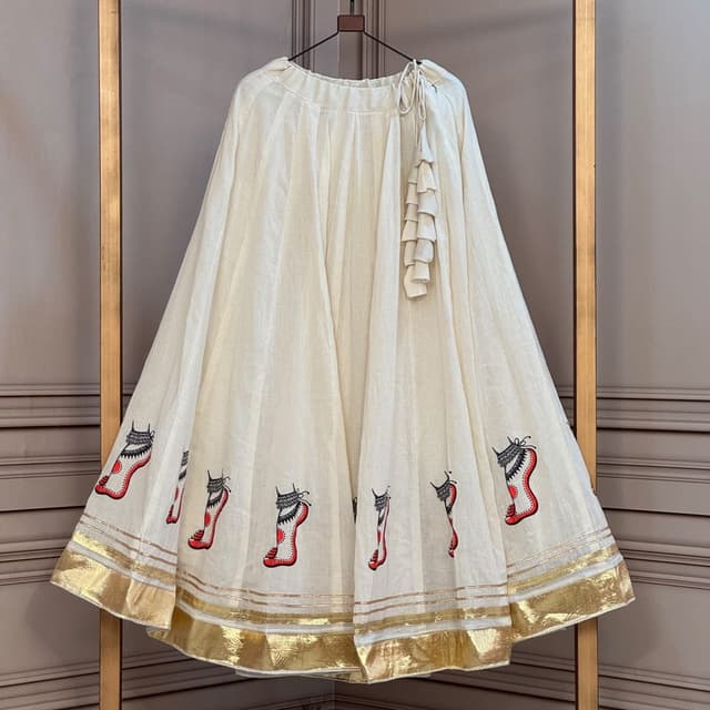 Off-white base, black and red hand-painted motifs, metallic gold border Lehenga Skirt