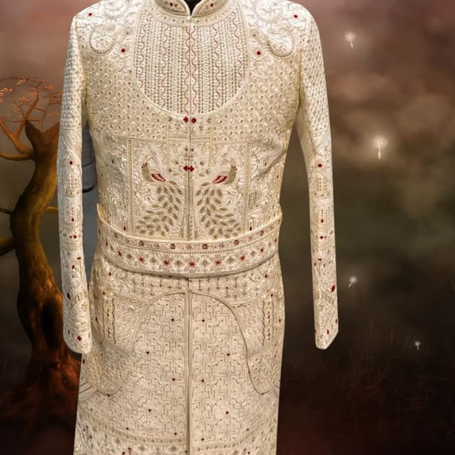 Off-white or cream base with gold and small crimson red accents Sherwani