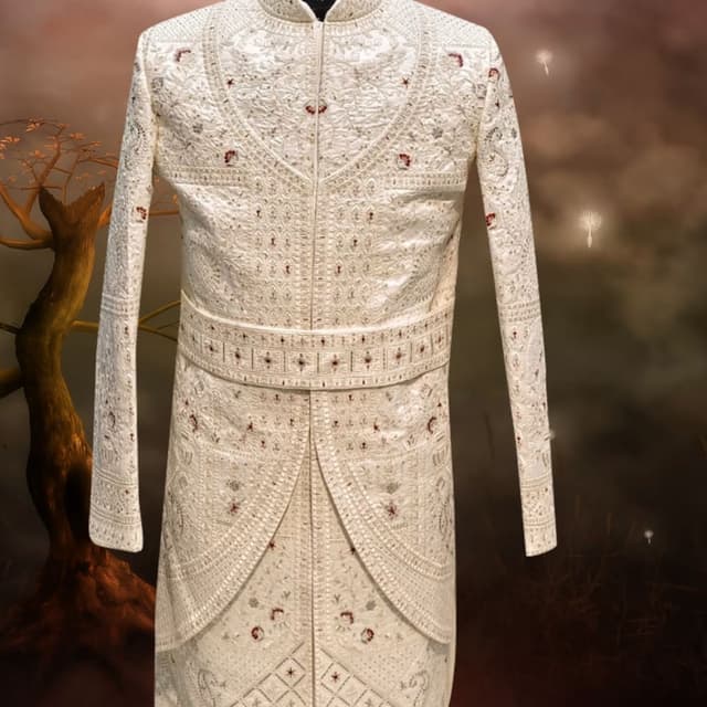 Off-white base with silver embroidery and hints of maroon accents Sherwani