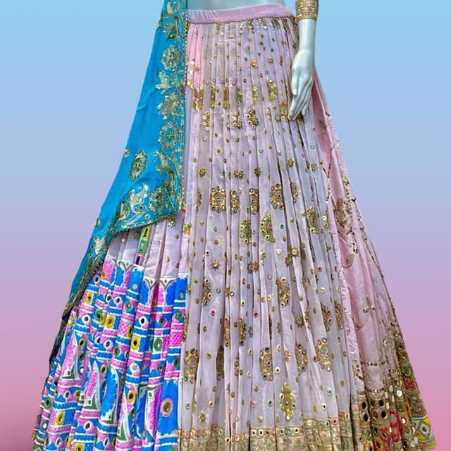 Pastel pink base with vibrant bright blue, magenta, yellow, and green accents Lehenga Choli