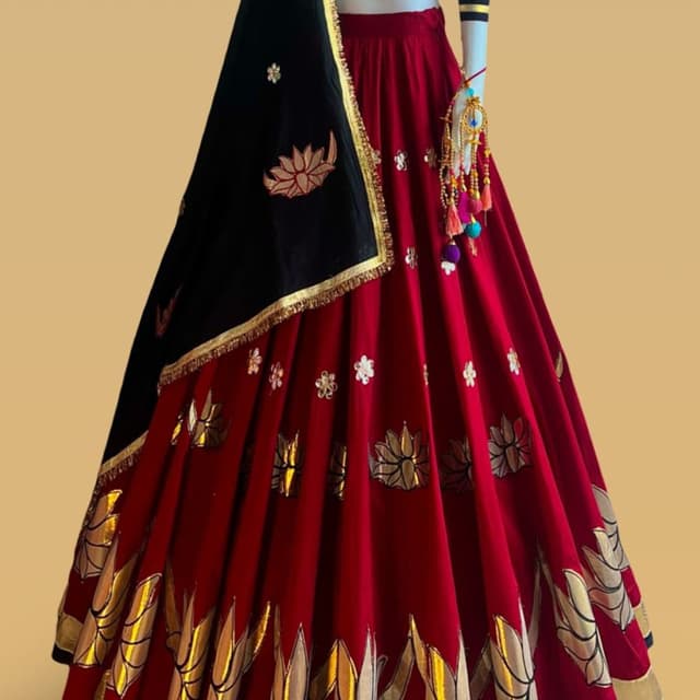 Deep red and black with metallic gold accents Lehenga Choli