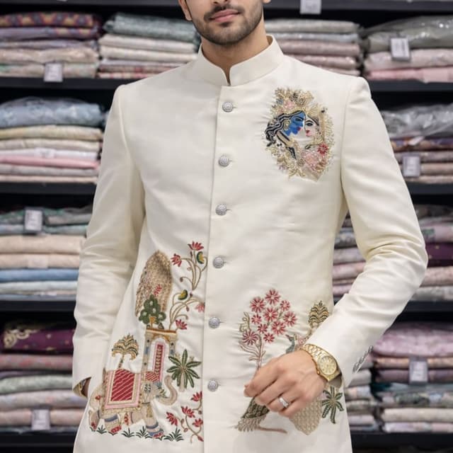 Off-white base with multi-color embroidery including shades of red, green, blue, pink, and gold Bandhgala / Jodhpuri Jacket
