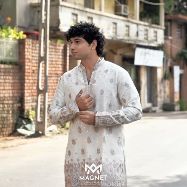 Off-white base with metallic gold or copper embroidery Kurta