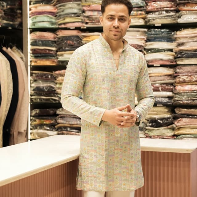 Mint green base with pastel multi-colored accents including yellow, pink, and light blue Kurta