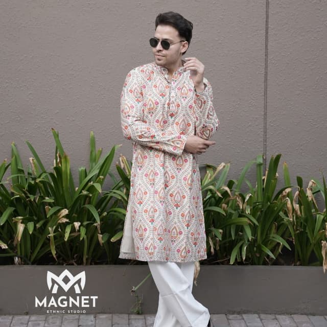 Off-white base with multi-colored floral and paisley print in orange, pink, green, and brown Kurta